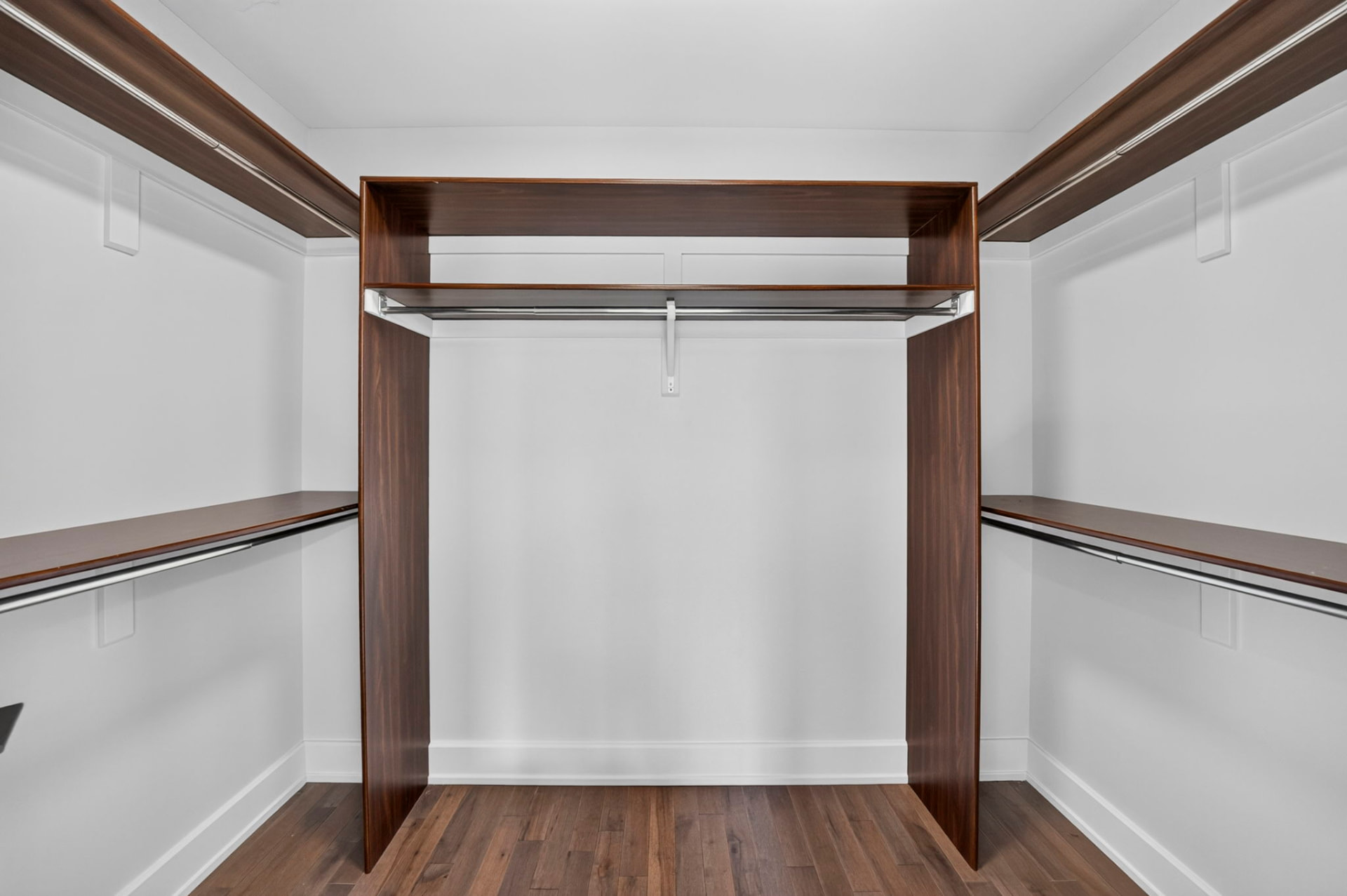 Walk-in closet with wood shelving