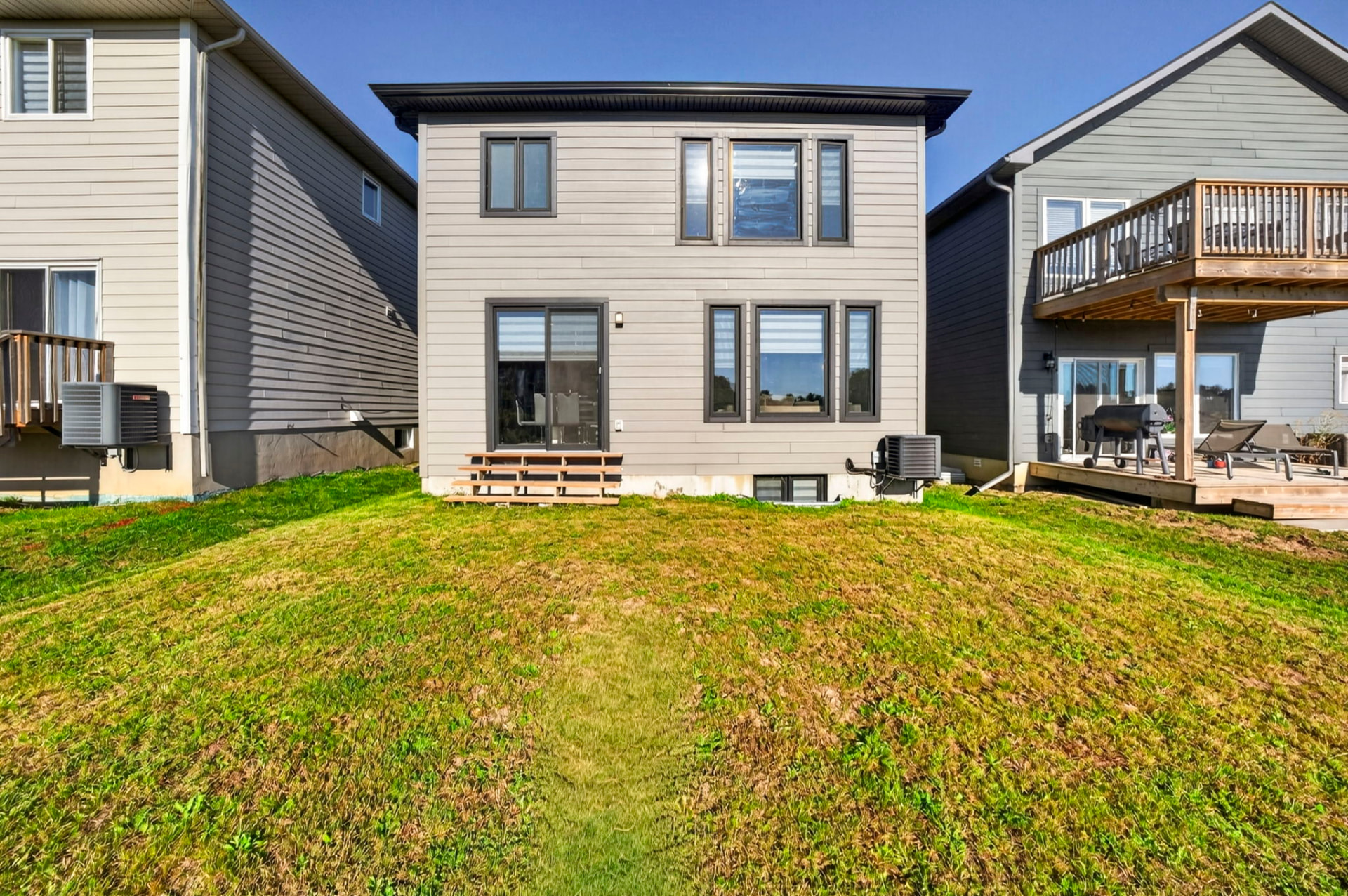 Rear elevation and open back yard